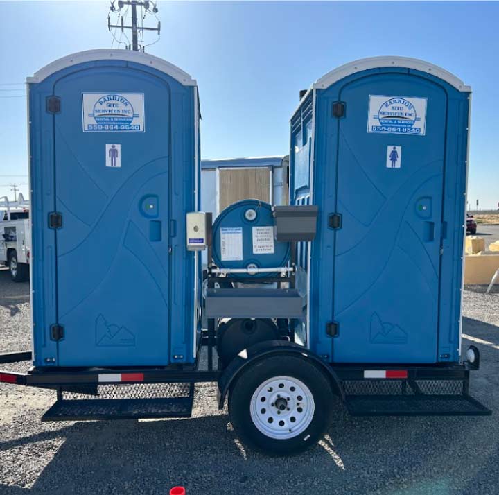 Durable double restroom trailer in Caruthers positioned on a remote agricultural site near Highway 41