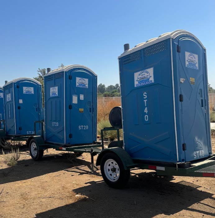 Mobile double restroom trailer in KINGSBURG, CA designed with an easy-access hitch for effortless site relocation.