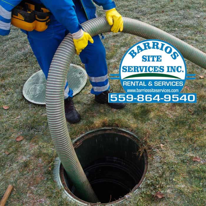 Professional technician performing a thorough septic tank cleaning for a residential property to ensure proper waste management and system health.