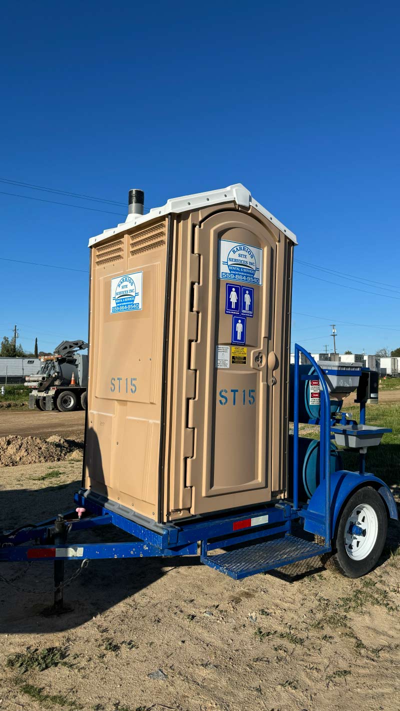 Barrios Site Services single towable portable toilet mounted on a heavy-duty trailer with an AG Pin hitch and integrated handwash station for mobile agricultural crews and remote job sites.
