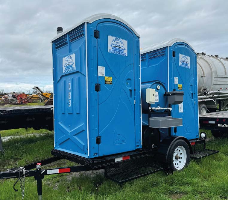 towable and mobile porta potties on a job site