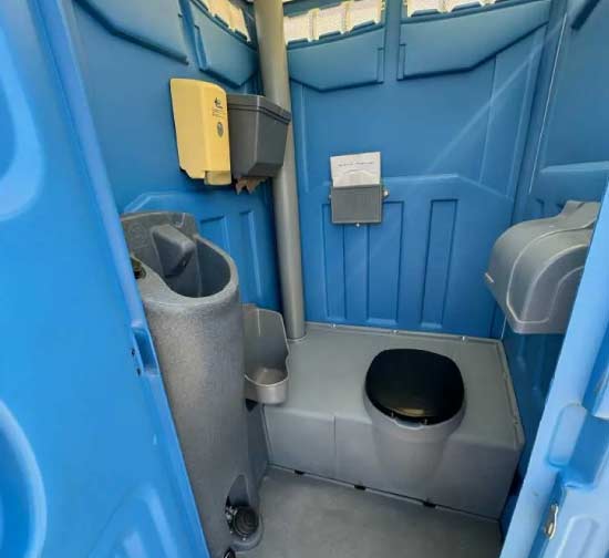 deluxe porta potty with a handwash sink 